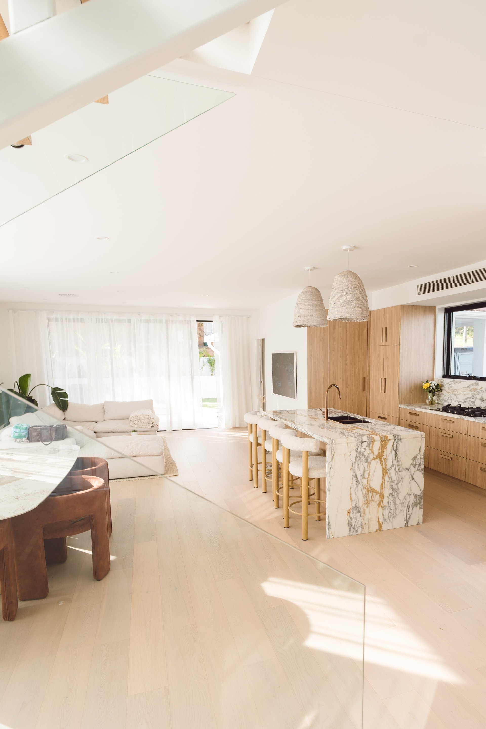 Open-plan living and dining area by ACG Built