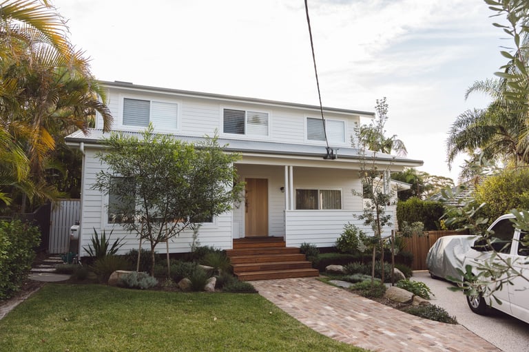 Full home renovation in Caringbah by ACG Built — modern two-storey weatherboard with timber entrance